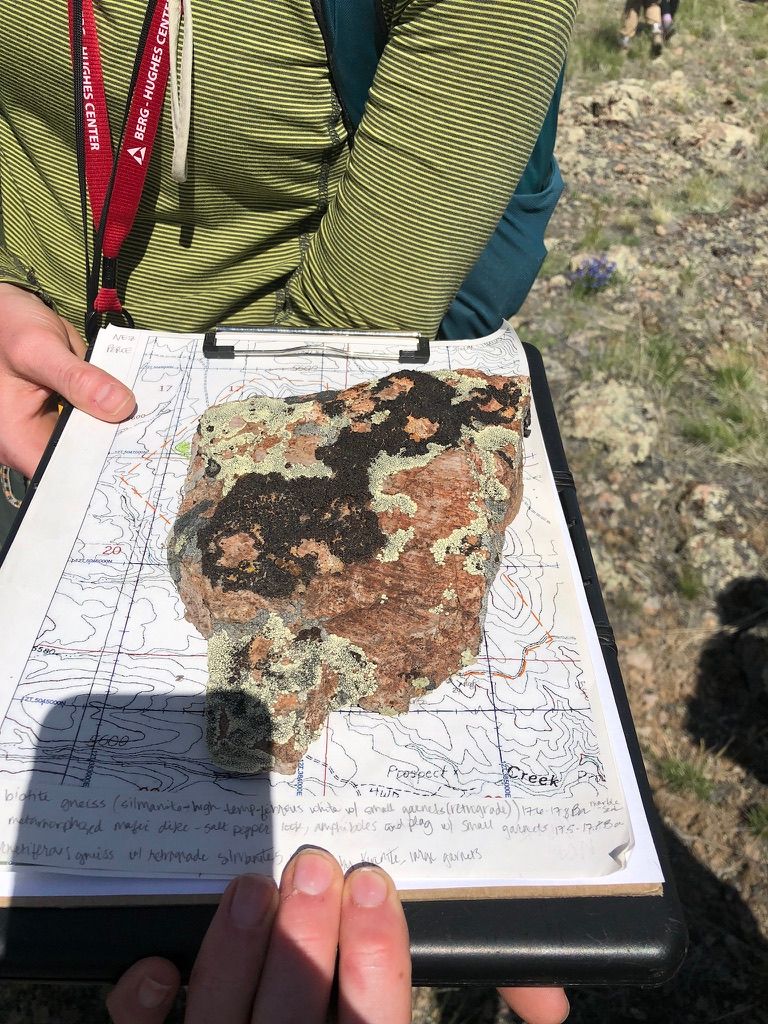 A biotite gneiss sample resting on an annotated topographic field sheet